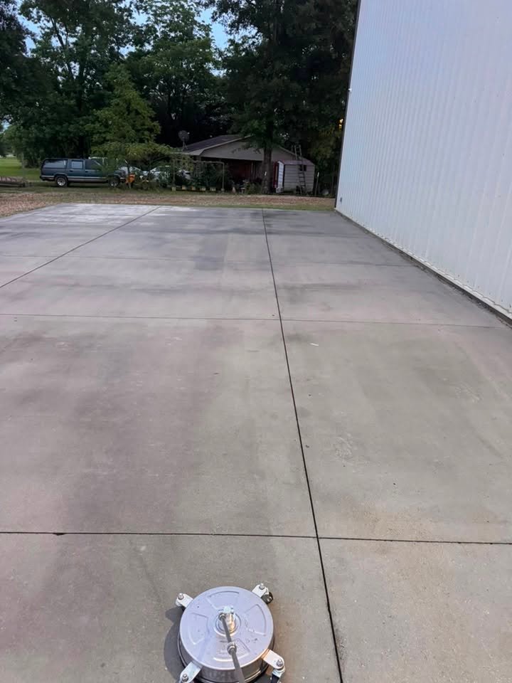 Pressure washing a concrete driveway in Southern Mississippi